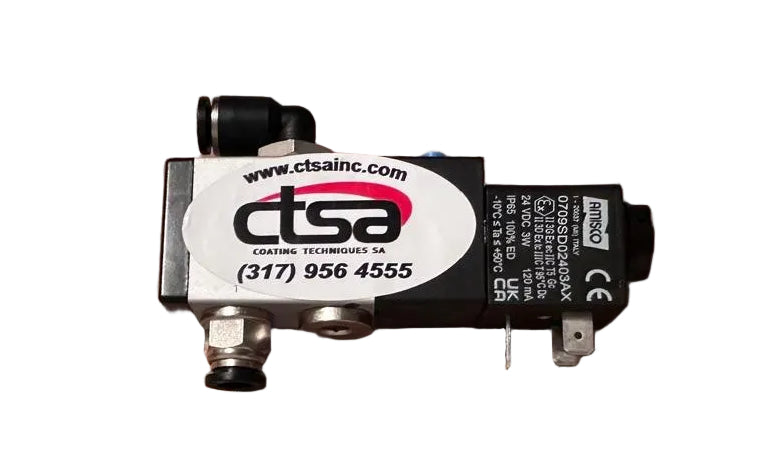 A black soleniod valve with white and red label on it, placed on a cardboard box with 'Electron' printed on it.