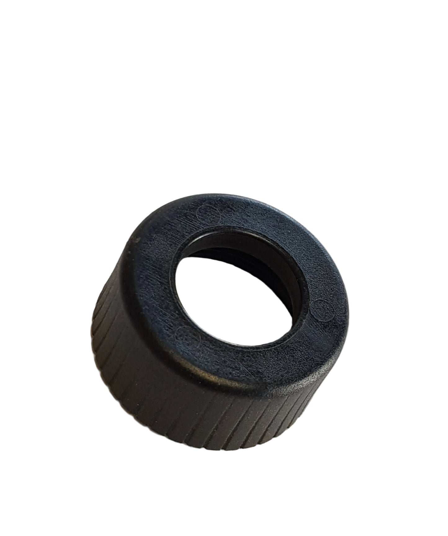 A black plastic fuel injector nut for a vehicle.