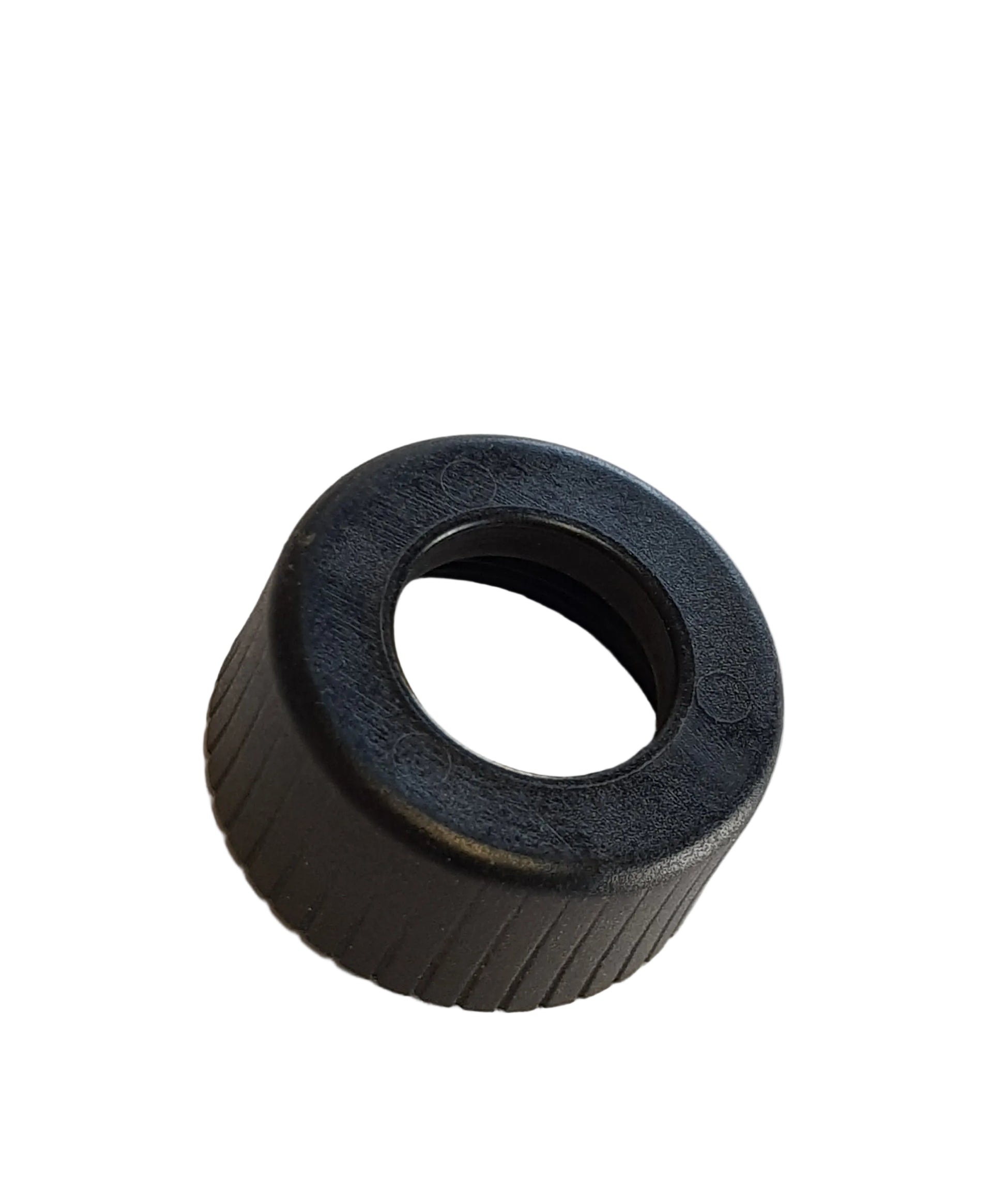 A black plastic fuel injector nut for a vehicle.